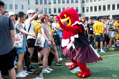 a group of students dancing with Marty, the ƻԺ mascot